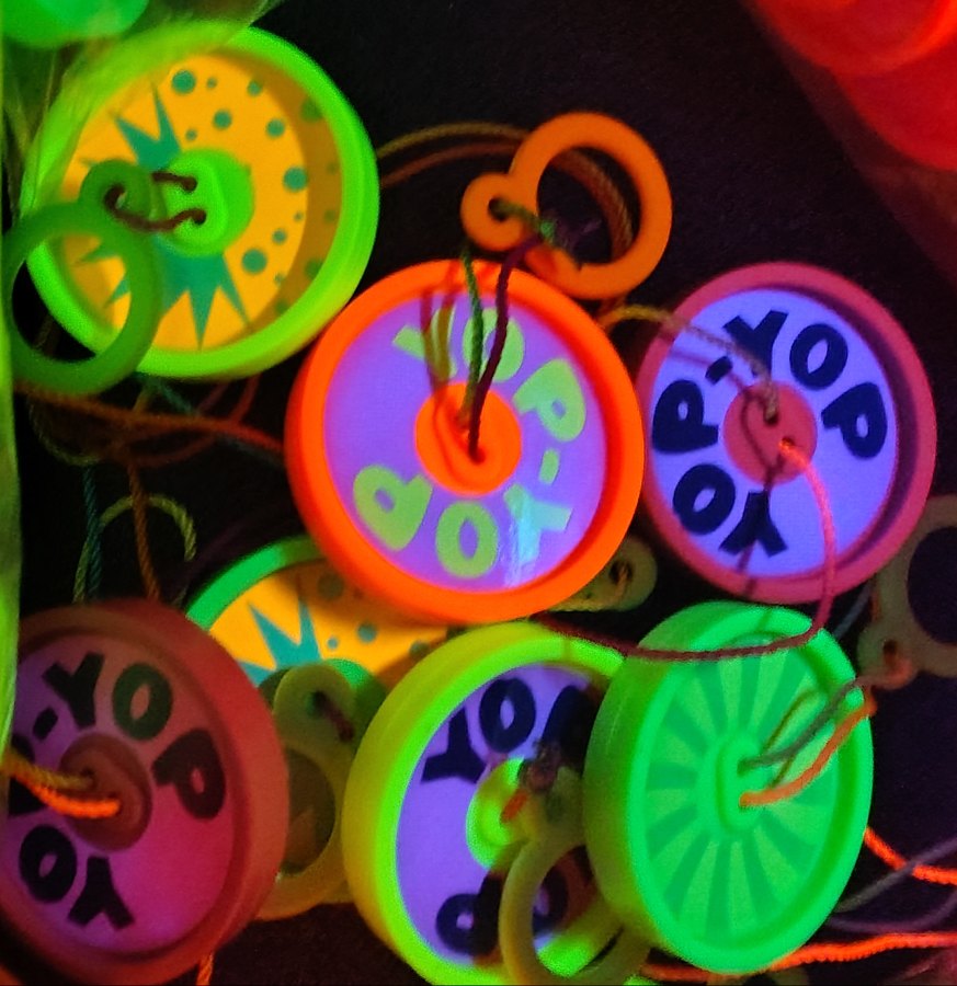 Yop-Yops glowing under a blacklight